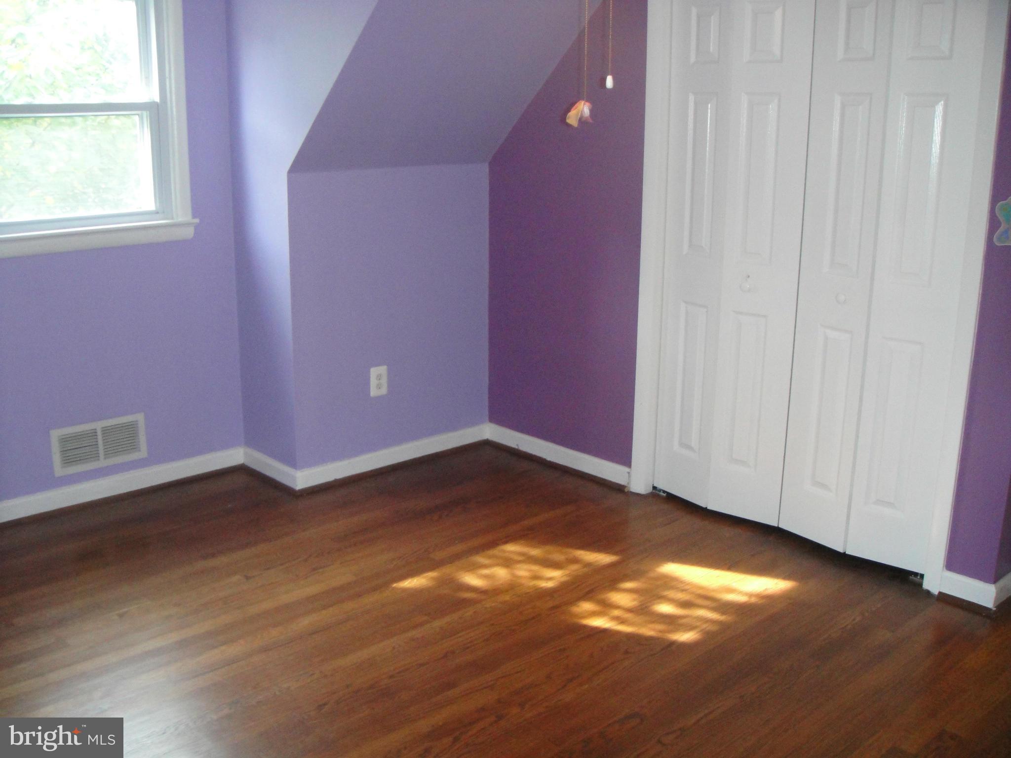 3701 Kayson Street Silver Spring, MD 20906 - Photo 20 of 30 a view of empty room with wooden floor and fan