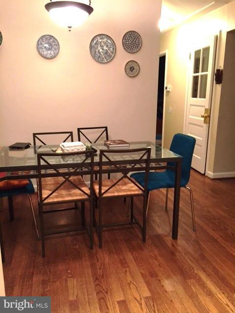 3701 Kayson Street Silver Spring, MD 20906 - Photo 5 of 30 a view of a workspace with furniture and wooden floor