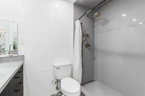 a bedroom with bed and a window