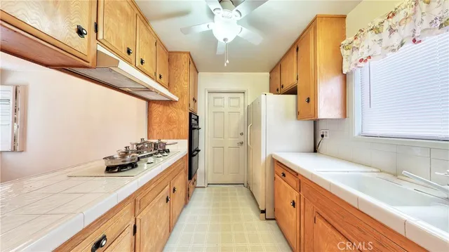 a spacious bathroom with a double vanity sink a mirror and a shower