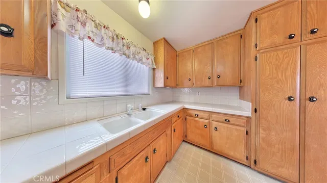 a view of a kitchen with cabinets