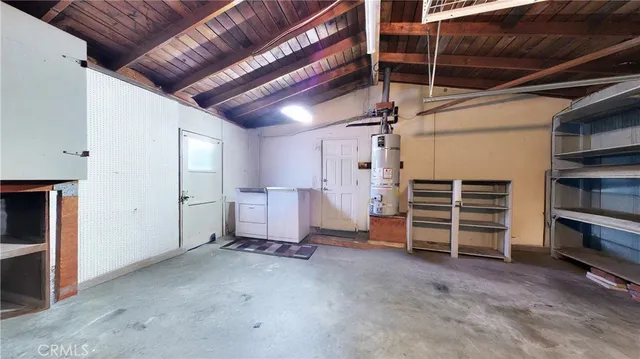 a view of empty room with wooden ceiling