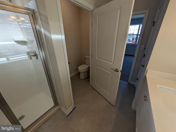 a spacious bathroom with a double vanity sink and a mirror