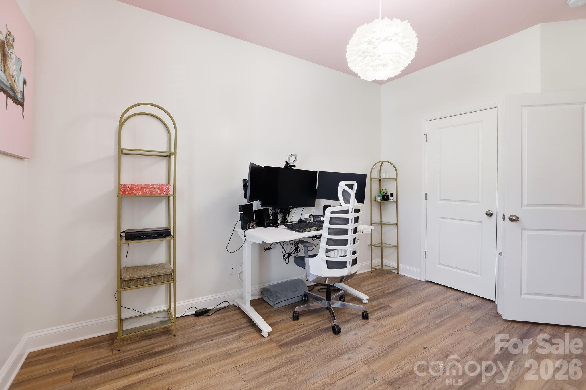 6038 Holland Street Fort Mill, SC 29707 - Photo 27 of 48 a view of a workspace with wooden floor and a window