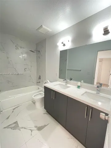 a bathroom with a sink and mirror