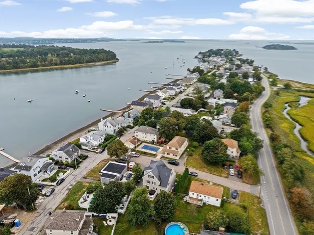 a living room with furniture and view of kitchen