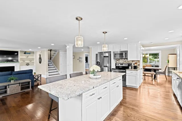 a view of an empty room with glass door and windows