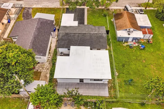 an aerial view of residential building with parking space