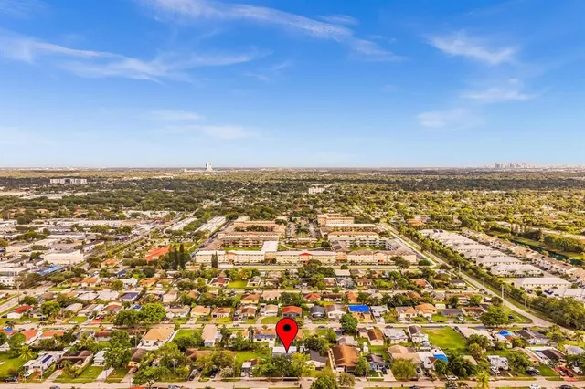 an aerial view of residential building and ocean