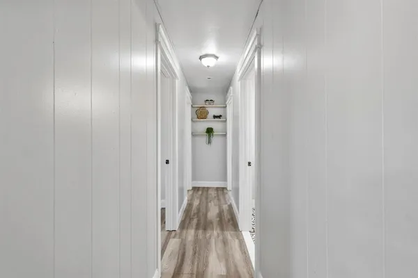 a kitchen with appliances a refrigerator and a sink