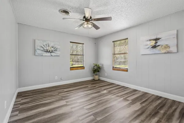 a view of room with window and ceiling fan