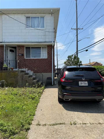 a car parked in front of a house