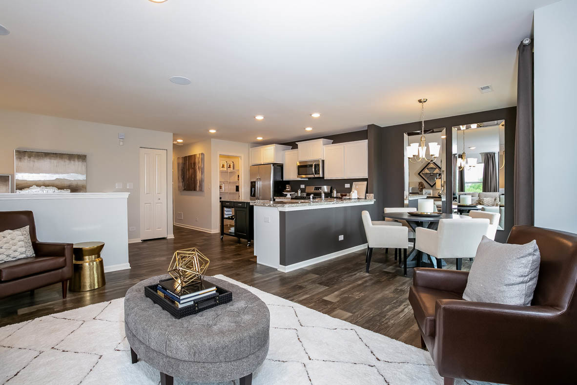 3837 Currant Lane Elgin, IL 60124 - Photo 2 of 10 a living room with furniture and a view of kitchen