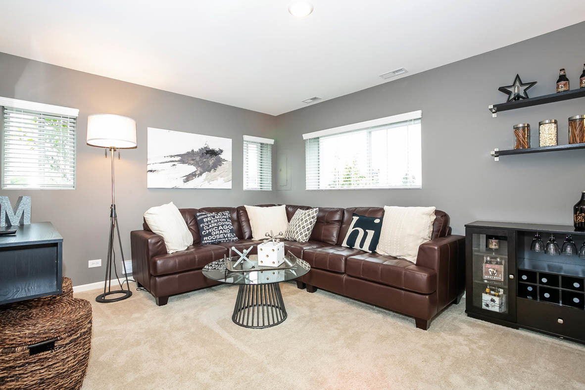 3837 Currant Lane Elgin, IL 60124 - Photo 7 of 10 a living room with furniture and a flat screen tv