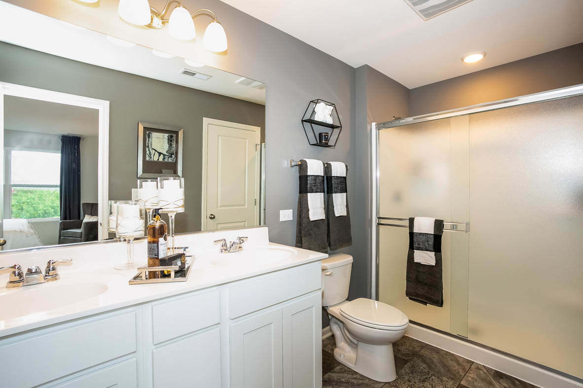 3837 Currant Lane Elgin, IL 60124 - Photo 9 of 10 a bathroom with a sink toilet and shower