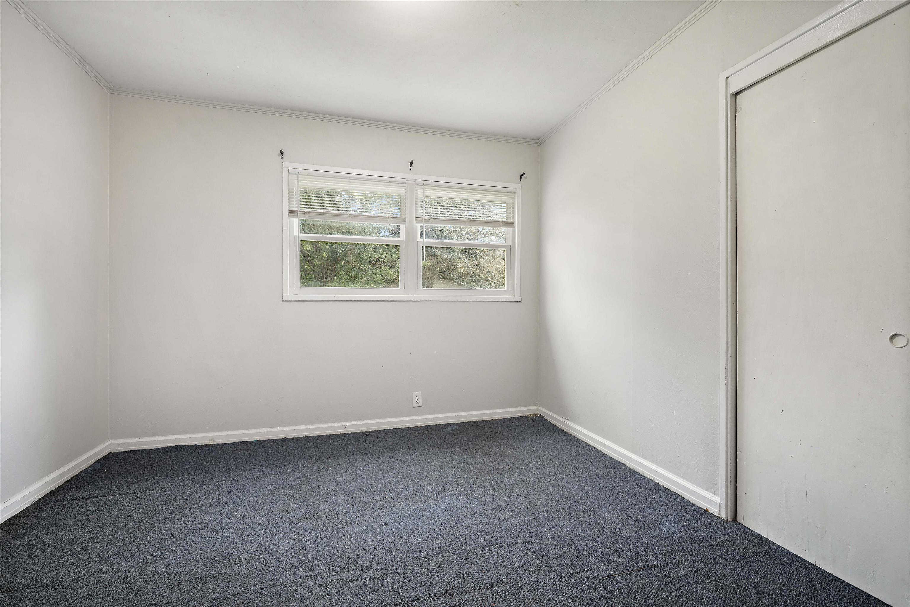 3014 Farcott Street Mobile, AL 36606 - Photo 15 of 26 Empty room featuring dark carpet and crown molding