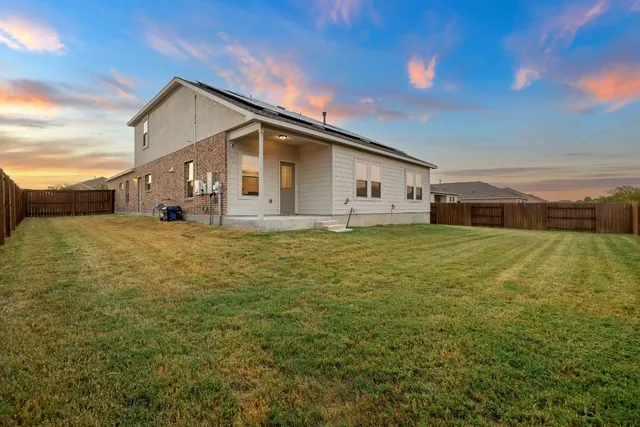 a big house with a big yard and more windows