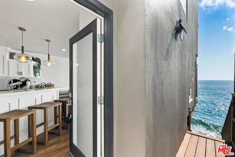 a spacious bedroom with a large bed and a large window