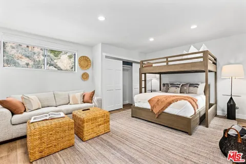 a spacious bedroom with a bed and a table