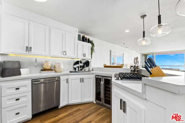 a large kitchen with a table and chairs