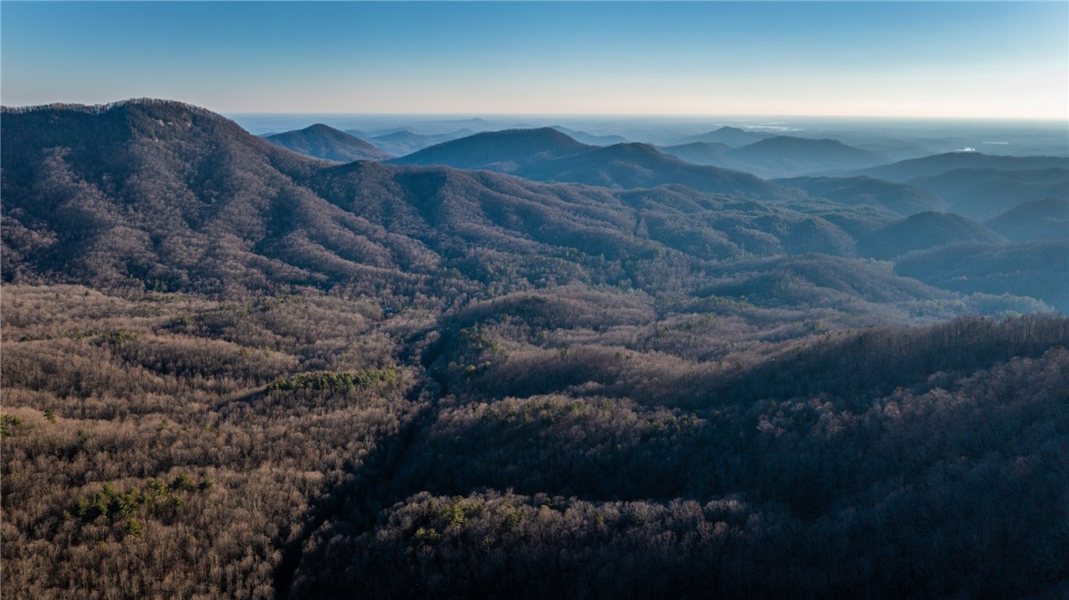 205 Rocky Bottom Road Sunset, SC 29685 - Photo 44 of 46 Layered mountain ridges stretch toward the horizon under a clear blue sky.