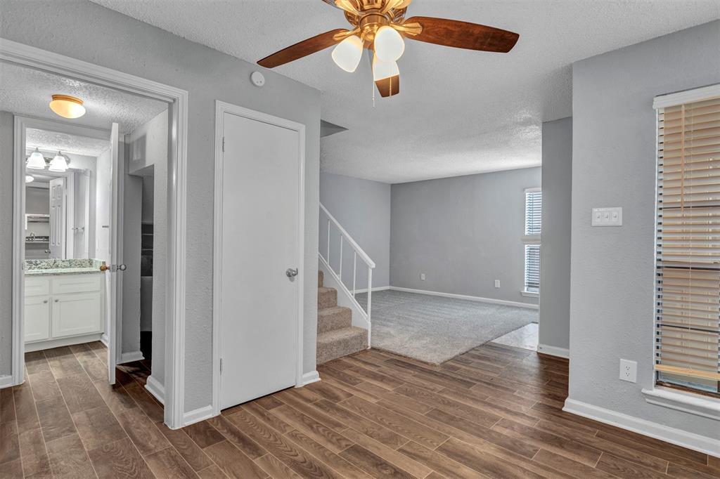 11311 Audelia Road, Unit 221 Dallas, TX 75243 - Photo 13 of 22 wooden floor in an empty room with a window and wooden floor