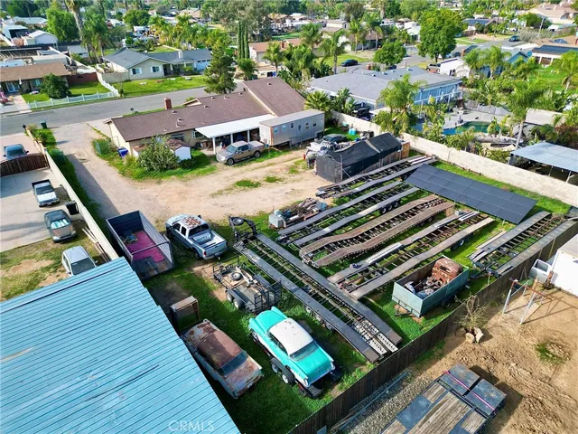 an aerial view of a residential houses with outdoor space