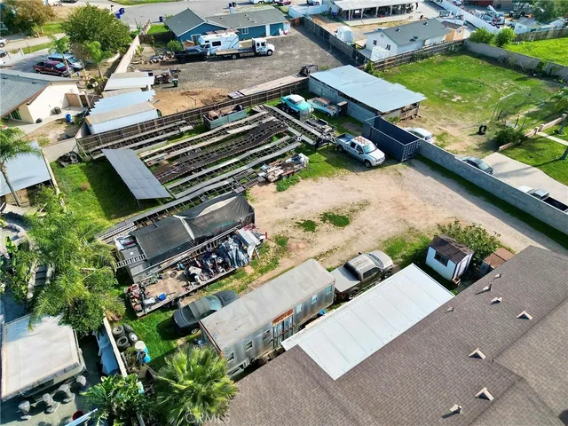 an aerial view of house with yard