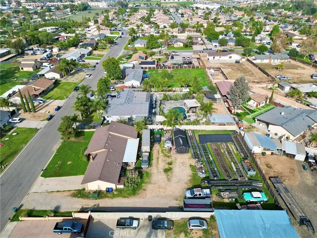an aerial view of residential houses with outdoor space