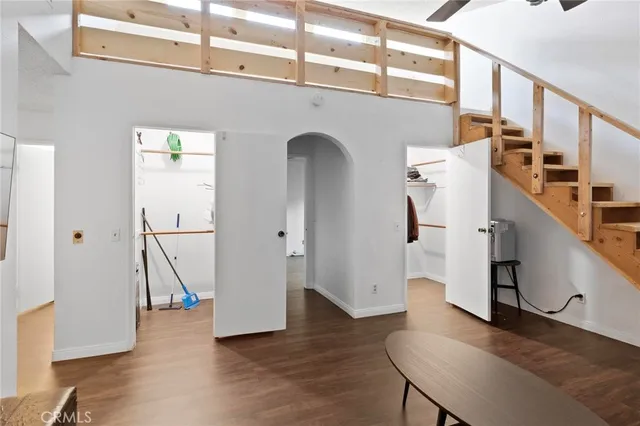 a view of entryway with wooden floor and stairs