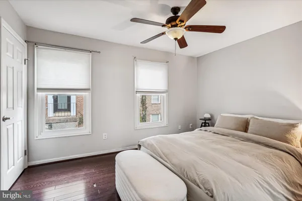 a bedroom with a large bed and a window