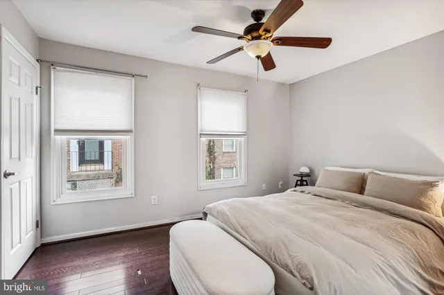 a bedroom with a large bed and a window