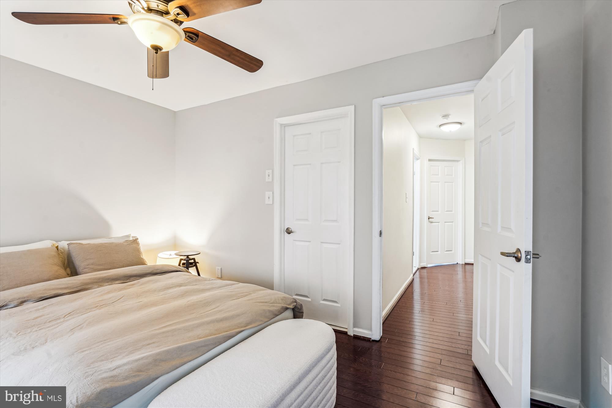 5039 9th Street South Arlington, VA 22204 - Photo 14 of 38 a bedroom with a bed and wooden floor