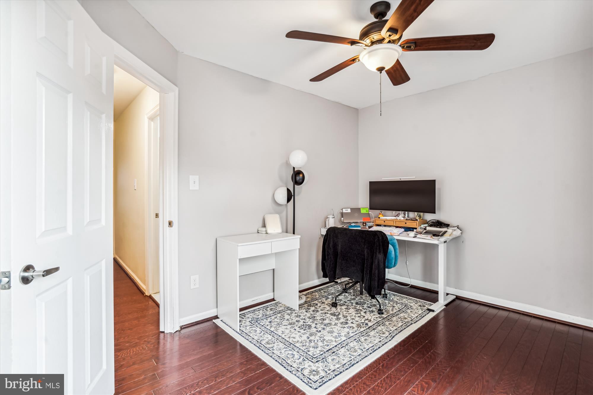 5039 9th Street South Arlington, VA 22204 - Photo 18 of 38 a view of workspace with wooden floor stairs and a window