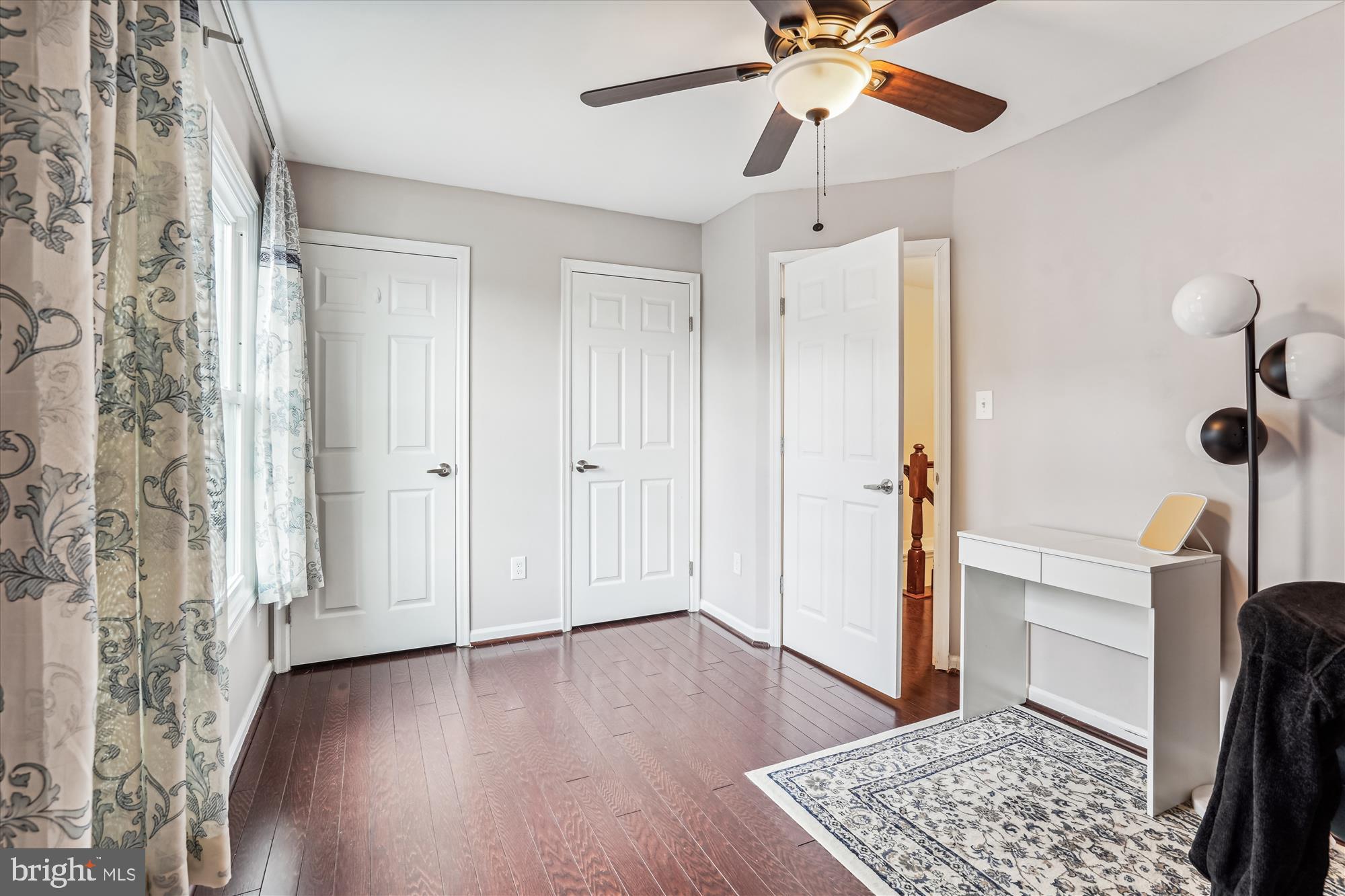 5039 9th Street South Arlington, VA 22204 - Photo 19 of 38 a view of entryway with a ceiling fan and wooden floor