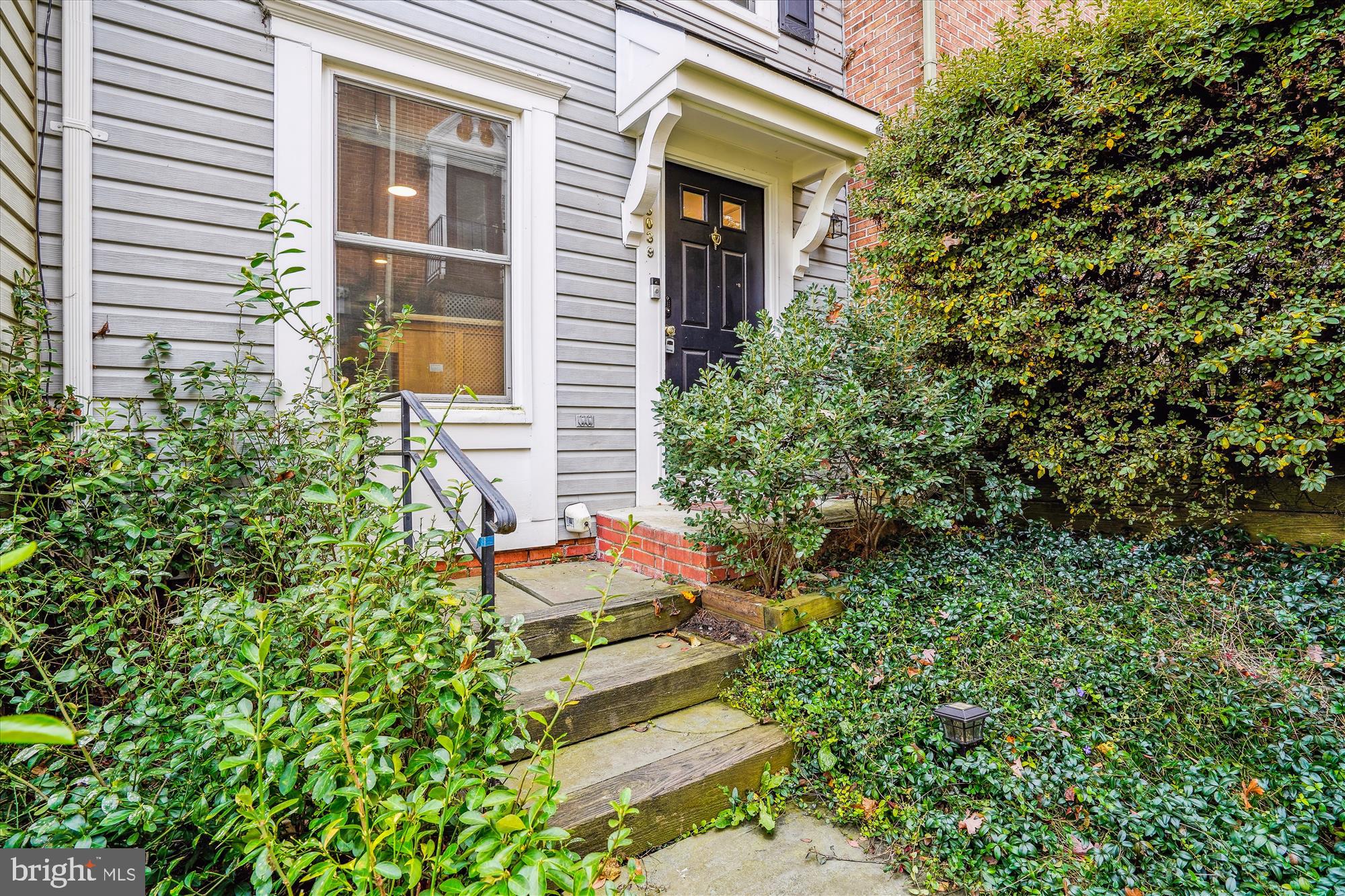 5039 9th Street South Arlington, VA 22204 - Photo 2 of 38 a backyard of a house with outdoor seating