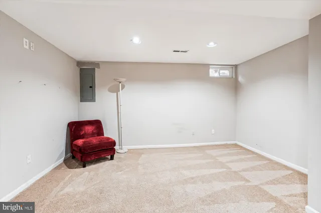 a room with a couch and a dryer