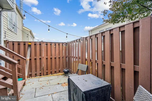 a view of a balcony with wooden fence