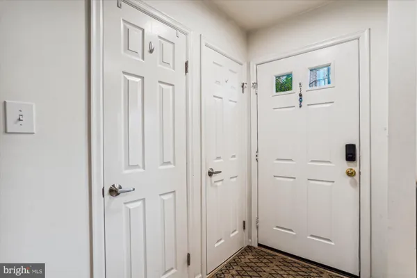 a view of a hallway with closet area
