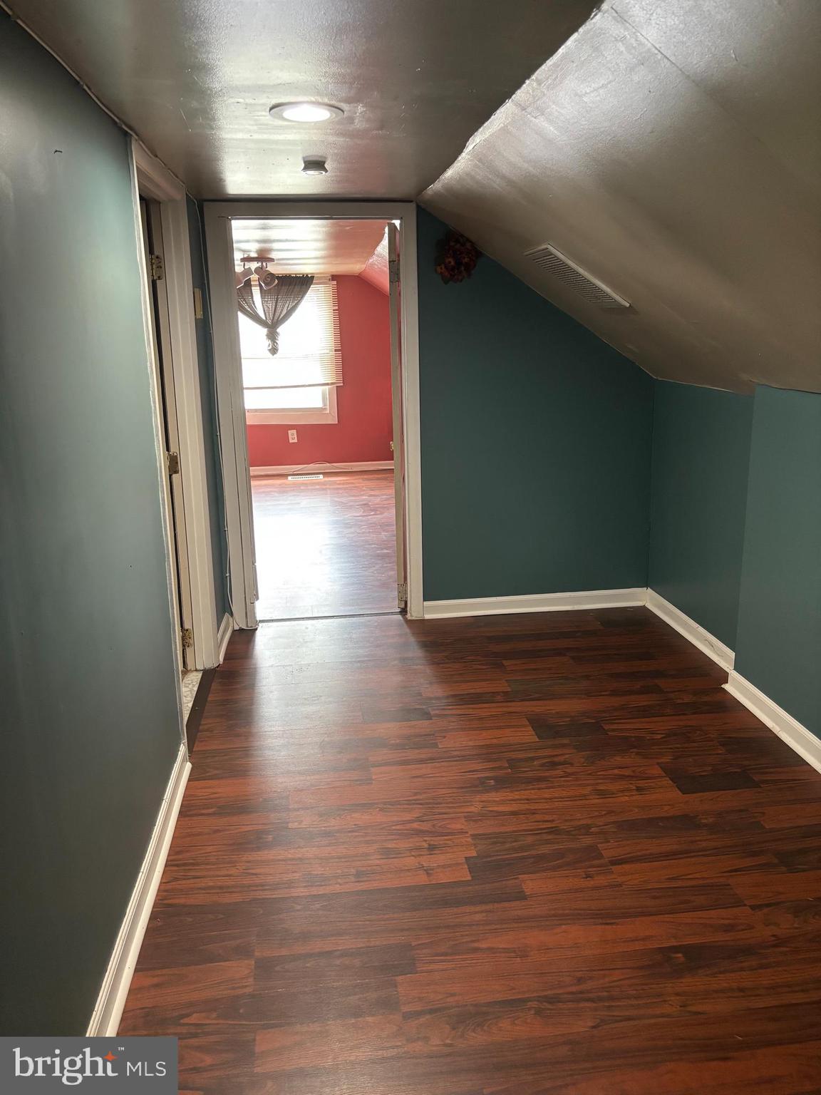 3015 Chesley Avenue Baltimore, MD 21234 - Photo 11 of 30 a view of a hallway with wooden floor