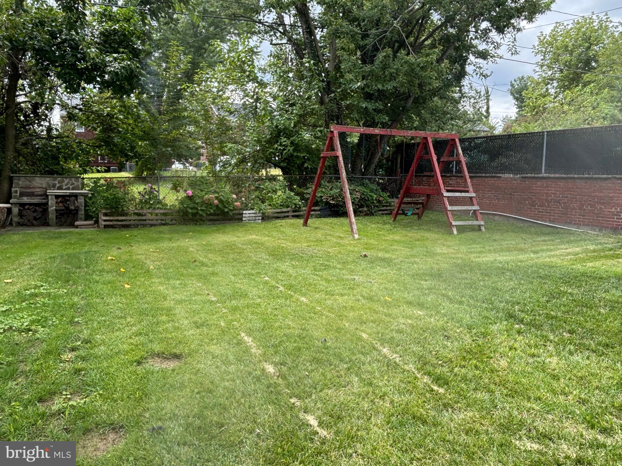 3015 Chesley Avenue Baltimore, MD 21234 - Photo 22 of 30 a view of a wooden deck and a park