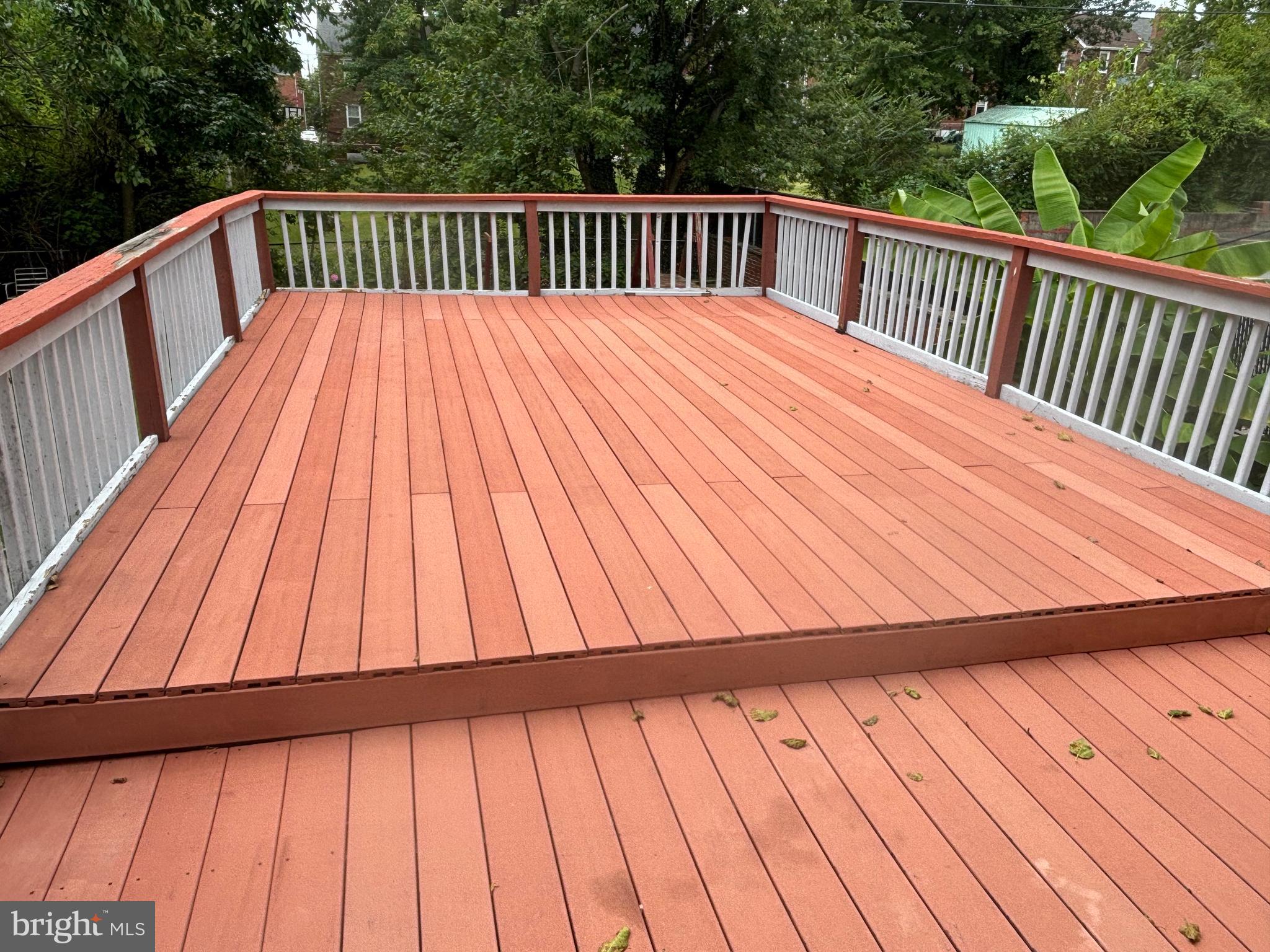 3015 Chesley Avenue Baltimore, MD 21234 - Photo 27 of 30 a view of backyard with deck and wooden floor