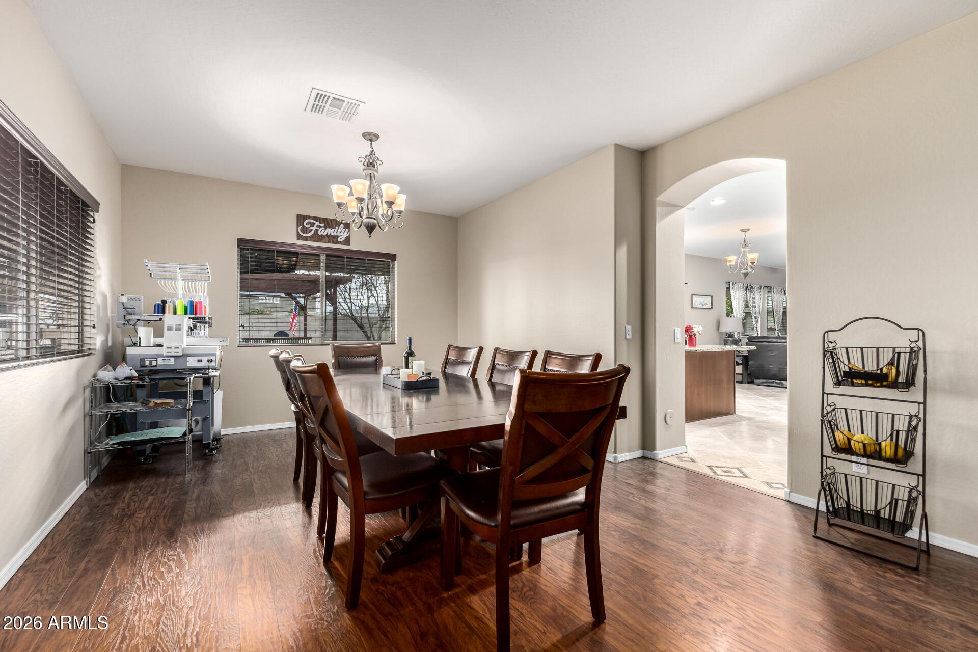 24541 Plum Road Florence, AZ 85132 - Photo 12 of 47 a view of a a dining room with furniture window and wooden floor