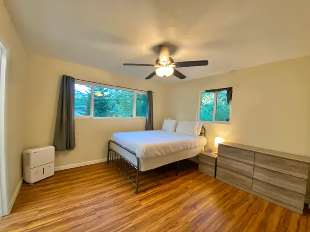 a bathroom with a toilet sink and shower