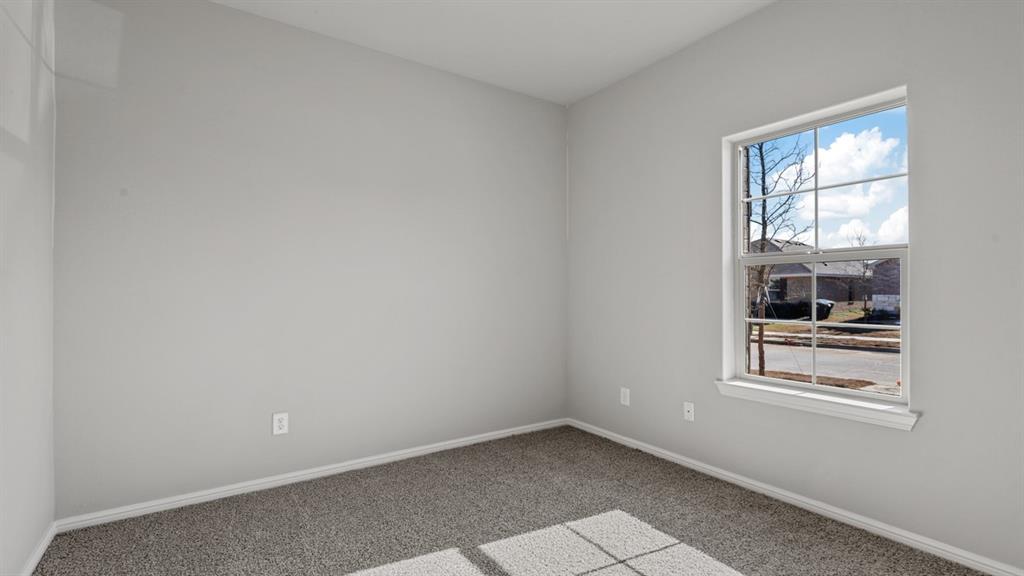 16421 Rangerville Drive Justin, TX 76247 - Photo 21 of 40 an empty room with windows