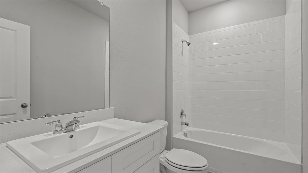 16421 Rangerville Drive Justin, TX 76247 - Photo 24 of 40 a bathroom with a sink toilet and bathtub