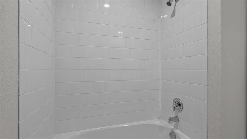 16421 Rangerville Drive Justin, TX 76247 - Photo 35 of 40 a bathroom with a bathtub