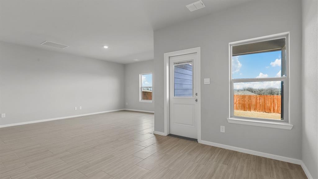 16421 Rangerville Drive Justin, TX 76247 - Photo 6 of 40 an empty room with windows and closet