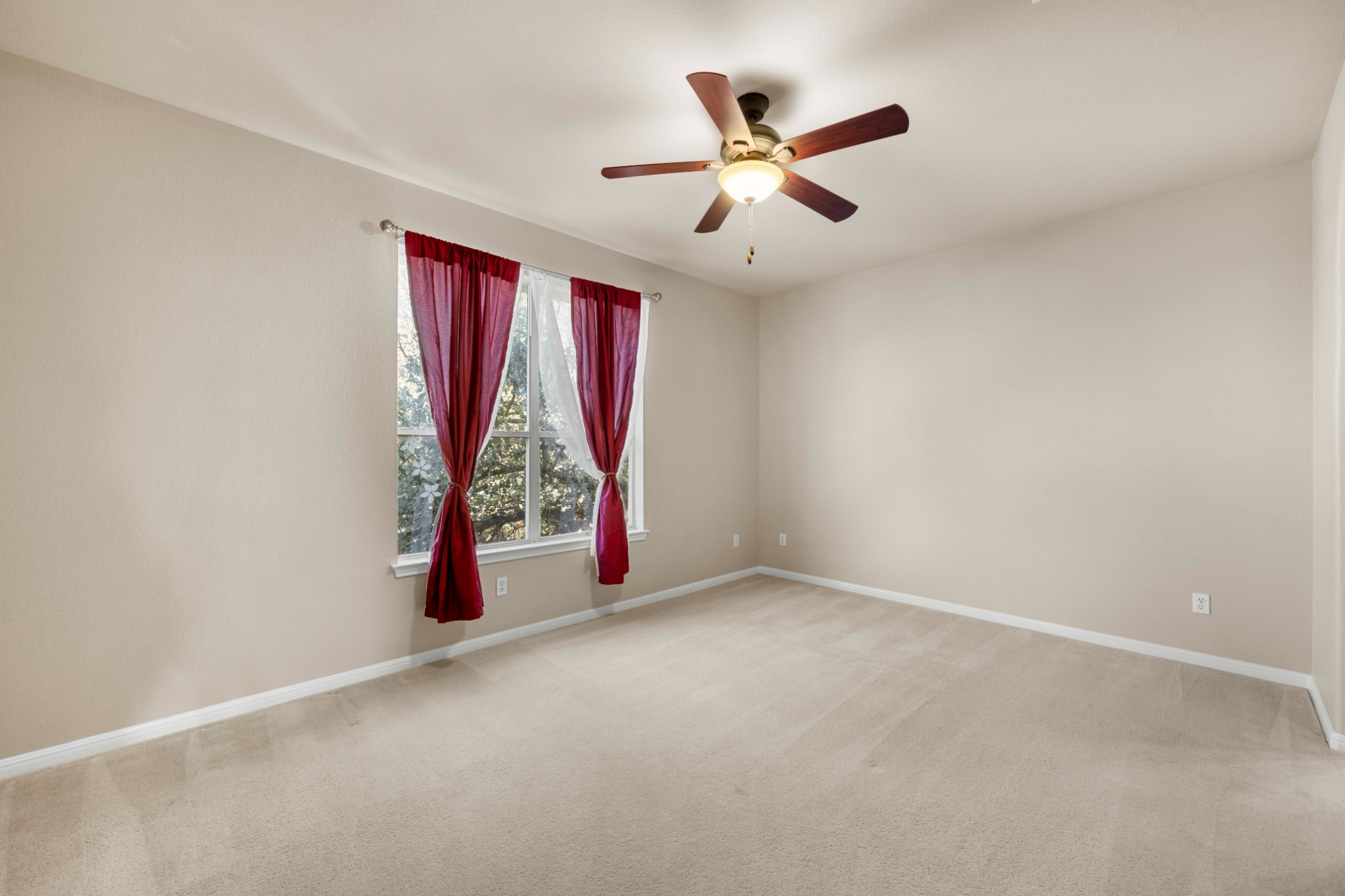3903 Remington Road Cedar Park, TX 78613 - Photo 25 of 29 A spacious bedroom provides a peaceful retreat with a ceiling fan and ample natural light.