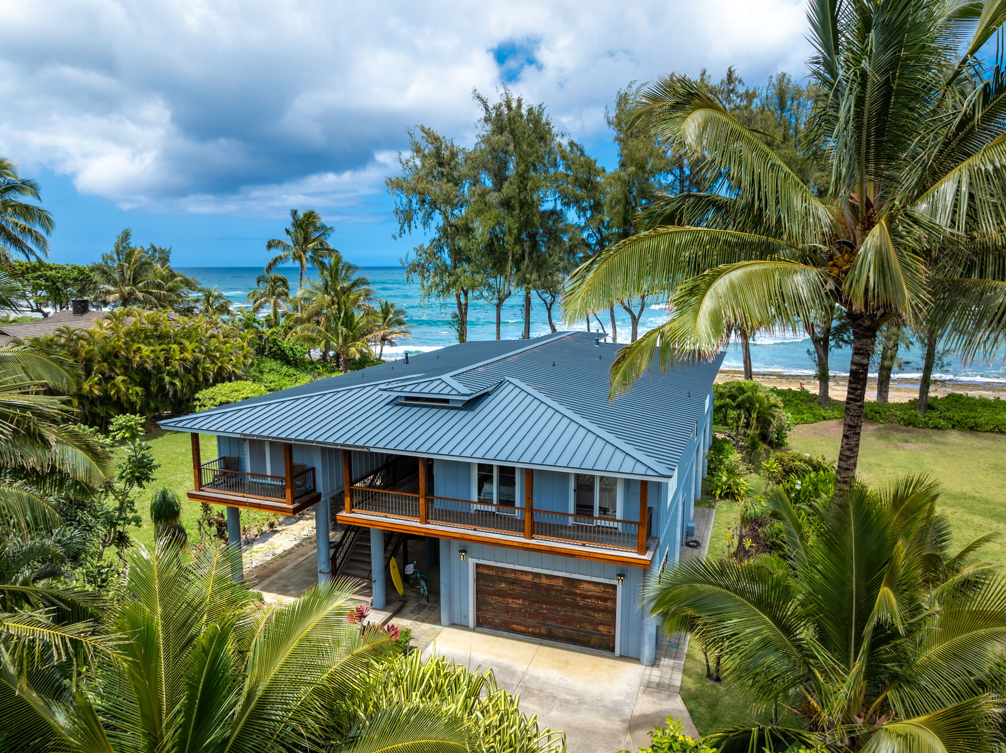 7312 Alealea Road Hanalei, HI 96714 - Photo 1 of 30 a front view of a house with a garden